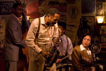 Michael Popgue and ensemble members James Vincent Meredith and Ora Jones